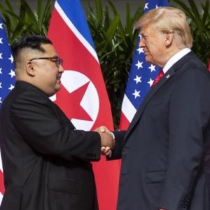 President Trump shakes hands with Kim Jong-un, June 12th 2018