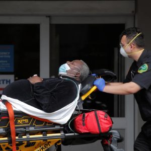 Paramedics take a patient into emergency center at Maimonides Medical Center during the outbreak of the coronavirus disease (COVID-19) in the Brooklyn borough of New York City, New York, April 7, 2020