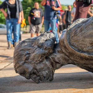Fallen Christopher Columbus statue outside the Minnesota State Capitol after a group led by American Indian Movement members tore it down in St. Paul, Minnesota on June 10, 2020