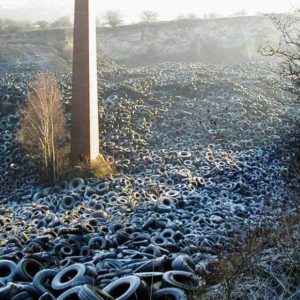 Fly-tipped tires in a disused chalk quarry in North Kent, England