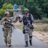 Soldiers from the U.S. Air Force and Pakistani Air Force bumping fists